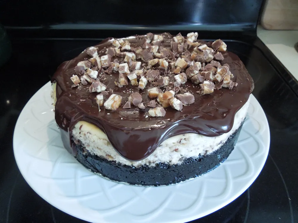 Sinful Snickers Cheesecake — Desserts recipe